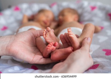 Mother Holding Premature Twins Legs