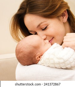 Mother Holds Cute Newborn Baby