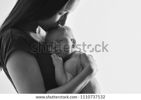 Similar – Mother hugging her newborn baby girl