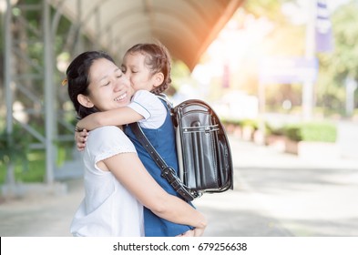 Mother Hug And Kiss Cute Girl Student Before Go To School, Love And Education Concept