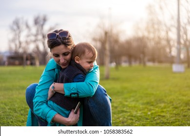 Mother hugging and comforting sad child - Powered by Shutterstock