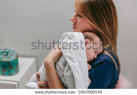 Similar – Image, Stock Photo Mother hugging her baby in front of fireplace