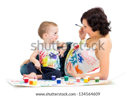 mother with kid boy drawing and painting together