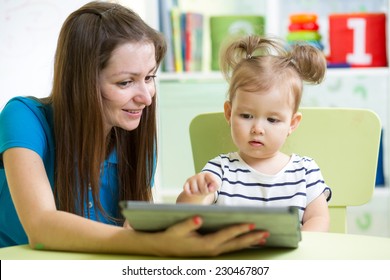 Mother And Kid Daughter With Tablet Pc