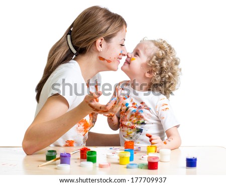 mother and kid girl painting together