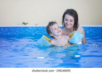 Mother And Kid In A Pool, Having Fun, Swimming