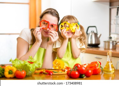 Mother And Kid Preparing Healthy Food And Having Fun