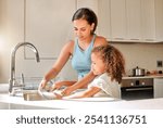 Mother, kid or washing dishes in kitchen for help, learning or responsibility development in home. Woman, girl or cleaning at sink for hygiene, bacteria prevention or teaching chores for child growth