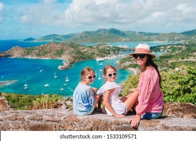 Mother And Kids At English Harbour At Antigua. View Of Paradise Bay At Tropical Island In The Caribbean Sea. Family Vacation.