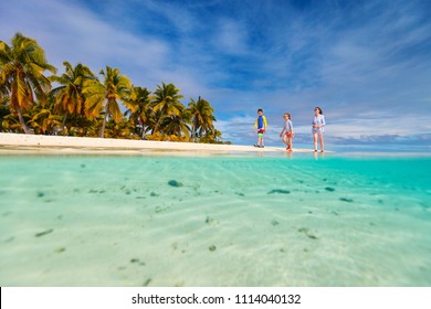 Mother And Kids Family At Tropical Beach On Aitutaki Island, Cook Islands, South Pacific