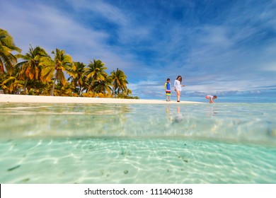 Mother And Kids Family At Tropical Beach On Aitutaki Island, Cook Islands, South Pacific