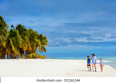 Mother And Kids Family At Tropical Beach On Aitutaki Island, Cook Islands, South Pacific