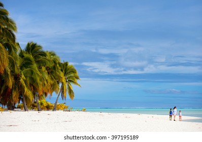 Mother And Kids Family At Tropical Beach On Aitutaki Island, Cook Islands, South Pacific