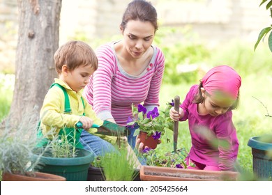 Mother And Kids Gardening