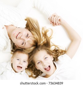 Mother With Kids.Happy Smiling Family Over White