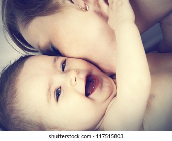 mother kissed her little baby, close-up - Powered by Shutterstock