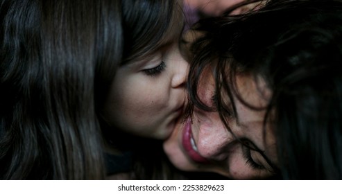Mother kissing daughter family love and affection - Shutterstock ID 2253829623