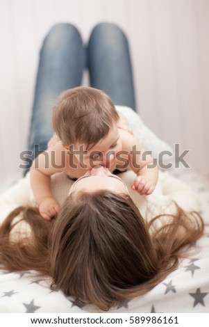 Similar – Image, Stock Photo happy mother and baby playing at home in bedroom
