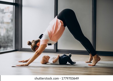 Mother With Little Baby Boy Practice Yoga