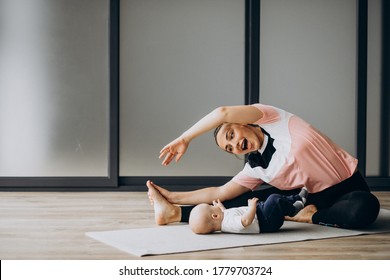 Mother With Little Baby Boy Practice Yoga