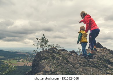 Mother With Little Boy Travelling In Mountains. Hiking Adventure With Child On Family Trip. Vacations Journey With A Kid, Looking At View.