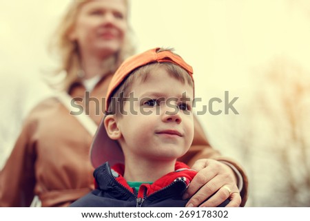 Mother with little boy in vintage style, outdoor portrait, Mother's day