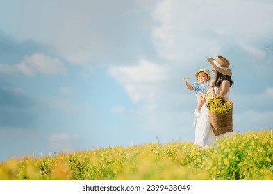 Mother with little child in flower blooming garden. woman with son in green leaves,happy family outdoors in spring - Powered by Shutterstock