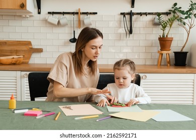 Mother and little daughter enjoy a creative morning by making crafts for kindergarten. - Powered by Shutterstock