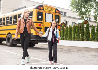 mother and little girl go to school - Shutterstock ID 2190115843