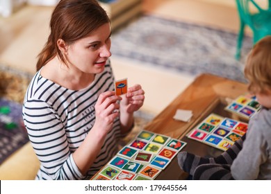 Mother And Little Son Playing Together Education Card Game For Children.