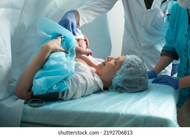 Mother look to her newborn baby in hospital - Shutterstock ID 2192706813