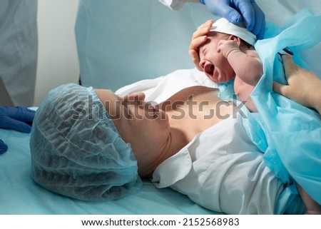 Mother look to her newborn baby in hospital