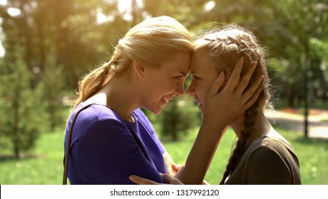 Mother Looking At Her Pretty Daughter With Love And Tenderness, Awkward Age