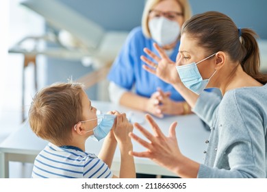 Mother With Nervous Son In Child Psychologist In Mask