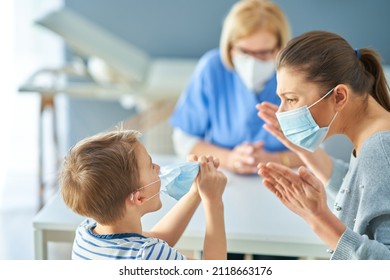 Mother With Nervous Son In Child Psychologist In Mask