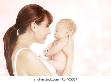 Mother And Newborn Baby, Mom Looking To New Born Child Face To Face, Kid One Month Old