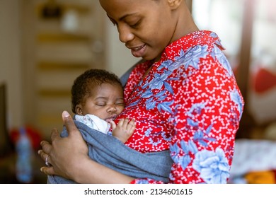 Mother with newborn in baby sling carrier at home
 - Powered by Shutterstock