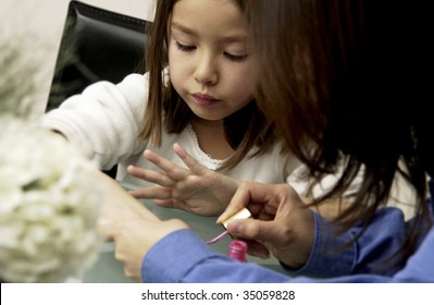 Mother Painting Daughter's Nails