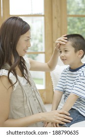 Mother Patting Son On The Head