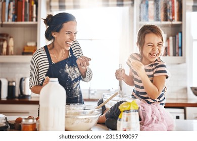 Mother, play or kid baking in kitchen as a happy family with an excited girl laughing or learning cookies recipe. Playful, flour or funny mom helping or teaching kid to bake for development at home - Powered by Shutterstock