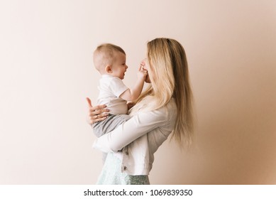 Mother Playing With Baby Boy, Happy Family Having Fun Indoor, Cheerful Sweet Kid Portrait, Mom And Child, Healthy Toddler, Lifting Throwing Carrying Holding Up Game