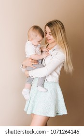 Mother Playing With Baby Boy, Happy Family Having Fun Indoor, Cheerful Sweet Kid Portrait, Mom And Child, Healthy Toddler, Lifting Throwing Carrying Holding Up Game