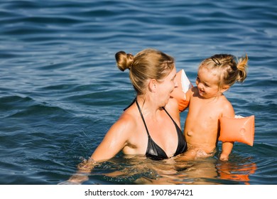 Mother playing with daughter in sea - Cirali, Antalya Province, Turkey