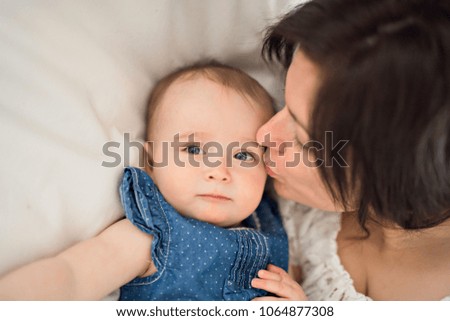 Similar – Image, Stock Photo Beautiful woman and her cute little daughter are hugging