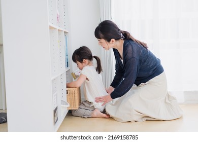 Mother playing with her child at home - Shutterstock ID 2169158785