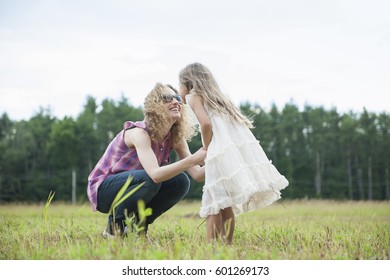 Mother Playing Outdoors With Her Daughter