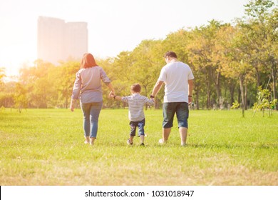 Mother Playing With Son  In The Field. Happy Family Life Style Concept.