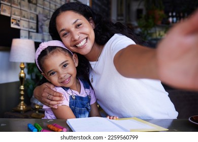 Mother portrait  girl child   selfie in cafe and book for drawing  learning art   color  Education  family   mama hug kid daughter   taking pictures for social media happy memory 