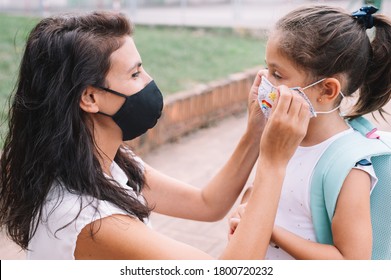 Mother Preparing Her Daughter For School On First Day After The Covid_19 Pandemic