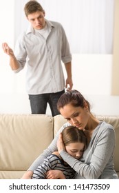 Mother Protecting Her Daughter From Angry And Violent Father